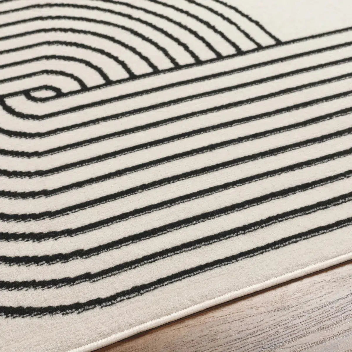 Tapis SURYA Constance rétro, motif arcs concentriques, blanc cassé et noir, vue 2