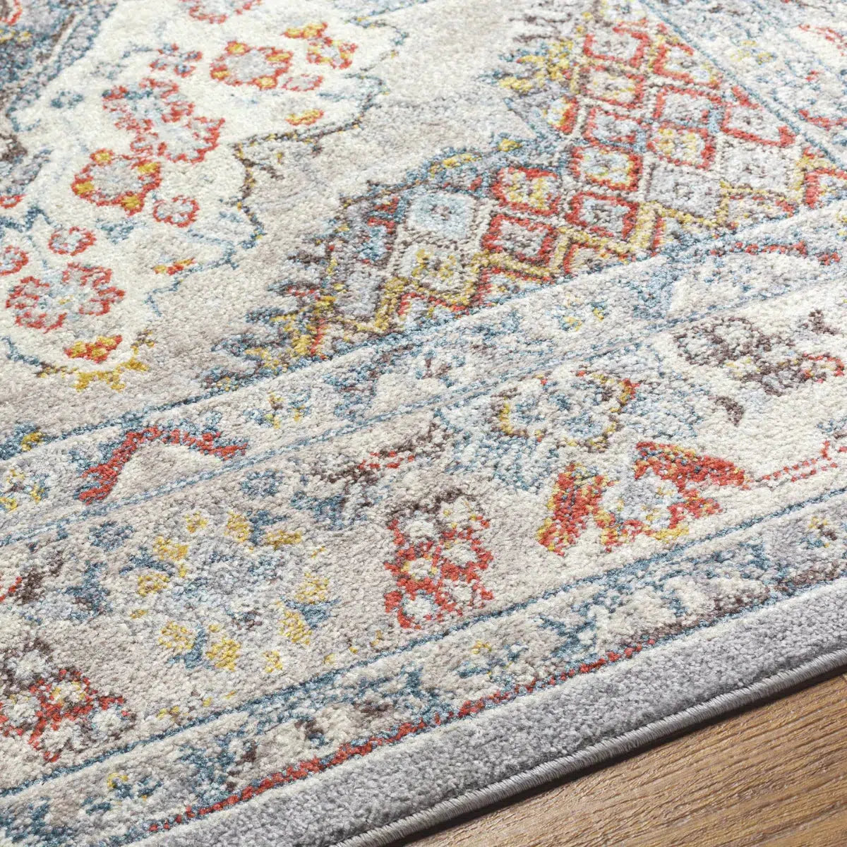 Tapis SURYA Jade oriental, médaillon bleu foncé, touches rouille et moutarde sur fond gris, vue 5